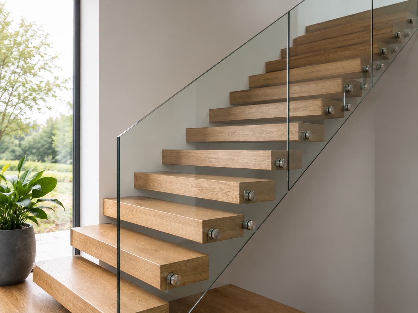 Laminated glass guardrail with stainless steel fixings on staircase